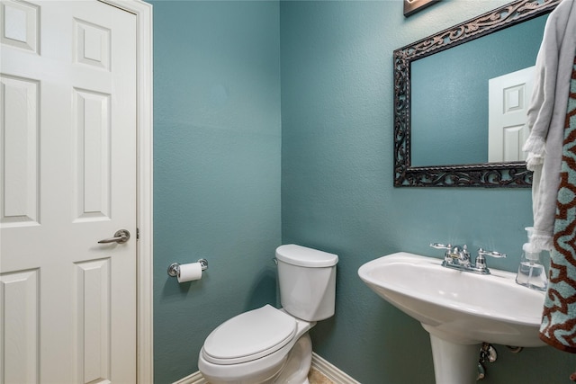 bathroom featuring toilet