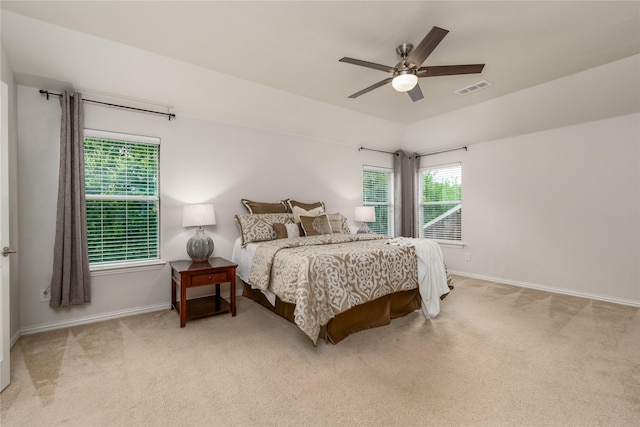 bedroom featuring vaulted ceiling, ceiling fan, and carpet floors