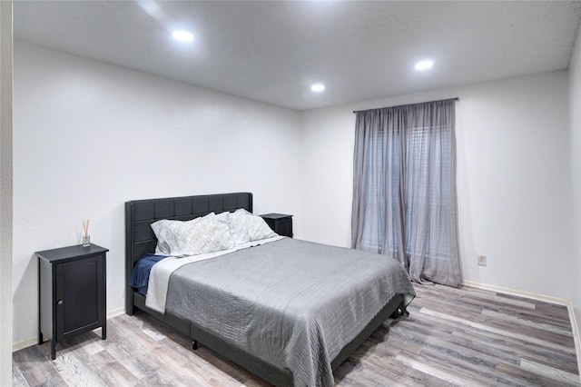 bedroom with light hardwood / wood-style flooring