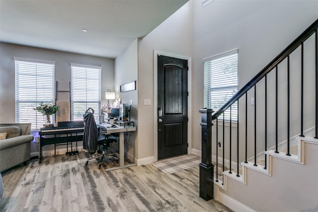 office with light hardwood / wood-style floors