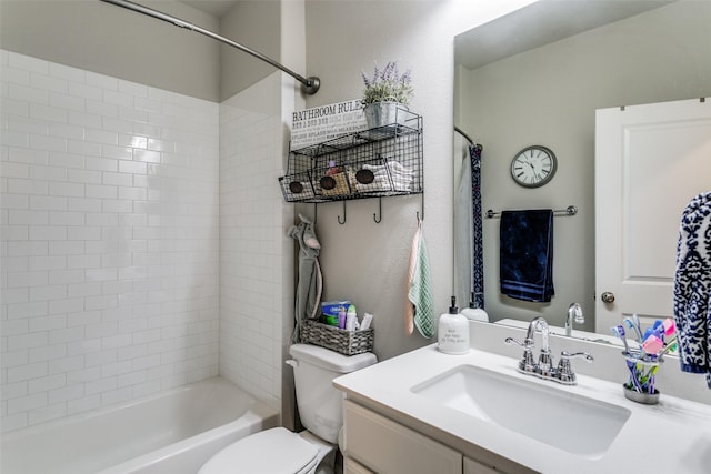 full bathroom featuring vanity, toilet, and tiled shower / bath combo