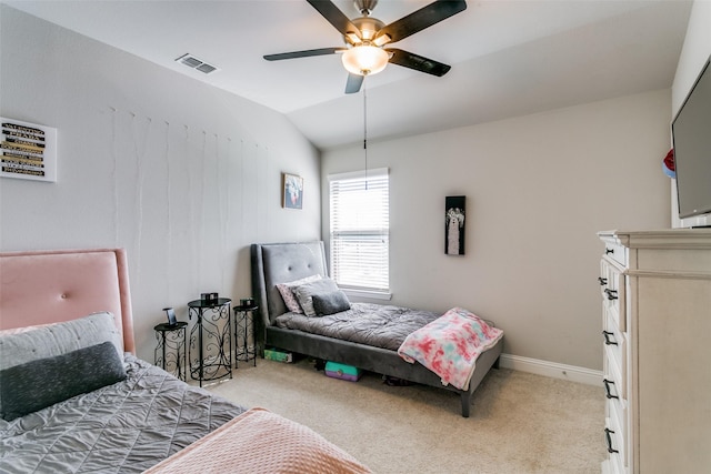 bedroom with vaulted ceiling, light colored carpet, and ceiling fan