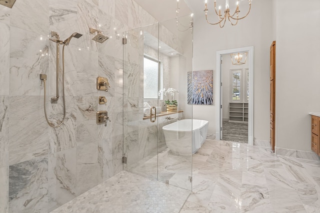 bathroom featuring plus walk in shower and a notable chandelier