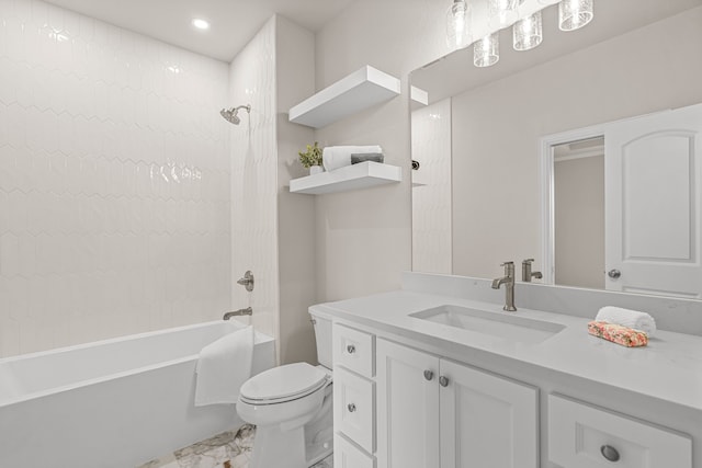 full bathroom featuring vanity, toilet, and tiled shower / bath combo