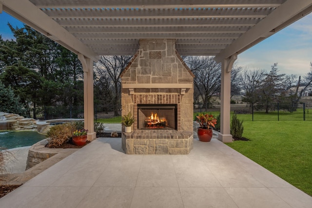 view of patio featuring an outdoor stone fireplace and a pergola