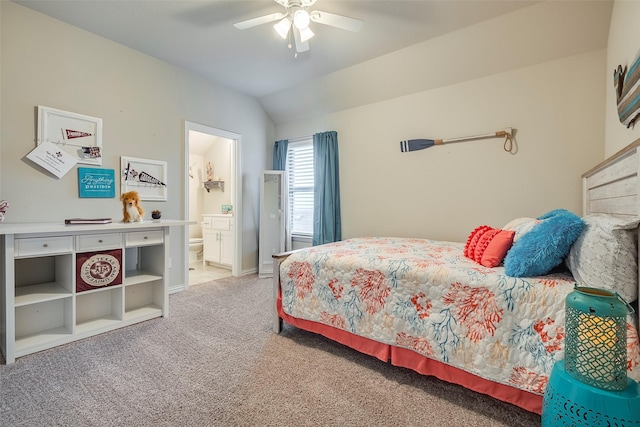 bedroom with connected bathroom, vaulted ceiling, ceiling fan, and carpet flooring