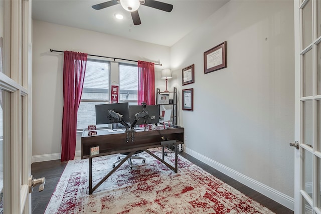 office area with dark wood-type flooring and ceiling fan