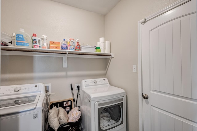 washroom featuring washing machine and dryer