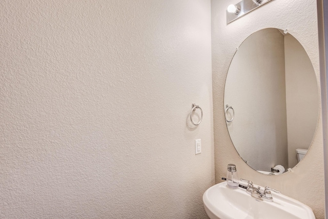 bathroom with sink and toilet