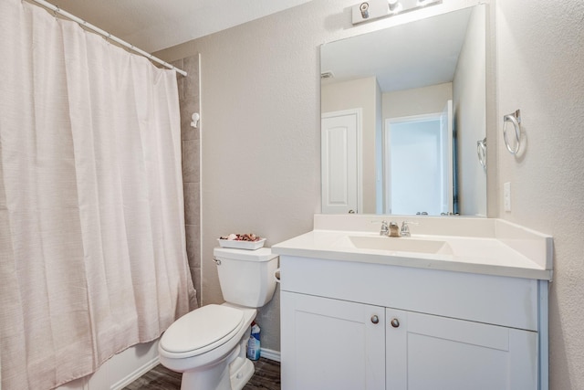 full bathroom featuring vanity, toilet, hardwood / wood-style floors, and shower / bath combo with shower curtain