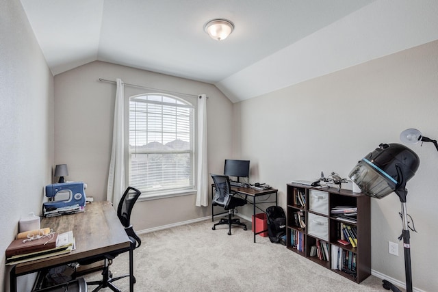 carpeted office with lofted ceiling