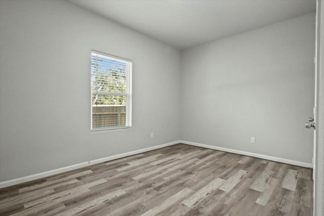 spare room featuring light hardwood / wood-style floors