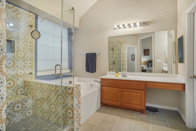 bathroom with vanity, vaulted ceiling, tile patterned floors, and plus walk in shower