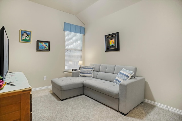 living room featuring light colored carpet and vaulted ceiling