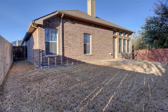 rear view of property with a patio area