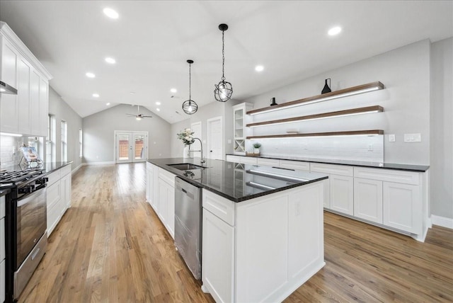 kitchen with white cabinetry, stainless steel appliances, and sink