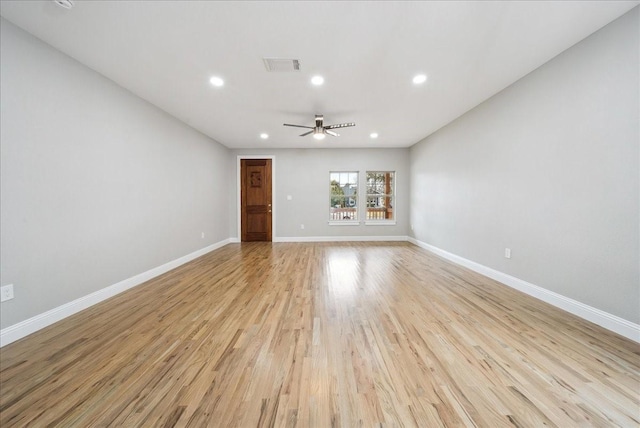 unfurnished living room featuring ceiling fan and light wood-type flooring