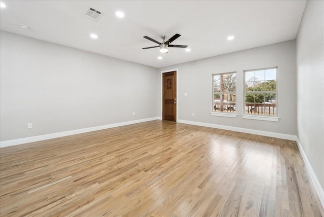 spare room with ceiling fan and light hardwood / wood-style flooring