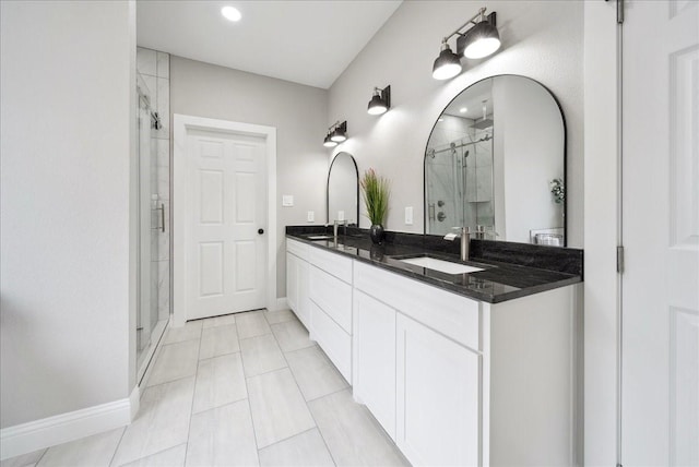 bathroom with an enclosed shower and vanity