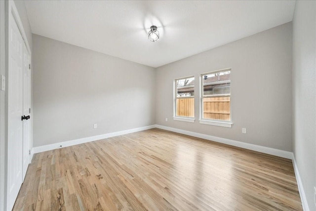 spare room featuring light hardwood / wood-style flooring