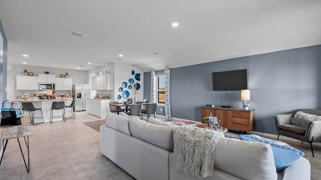 living room featuring lofted ceiling