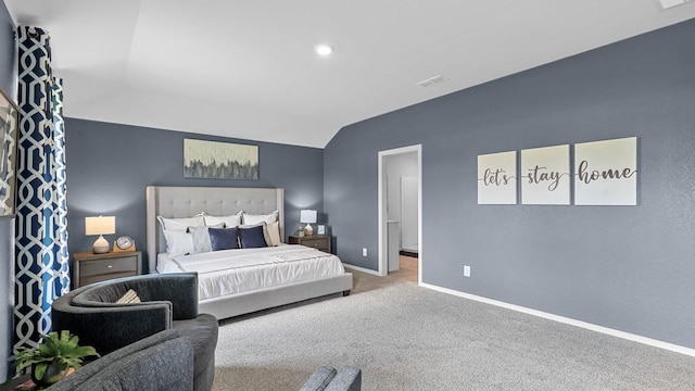 carpeted bedroom featuring lofted ceiling