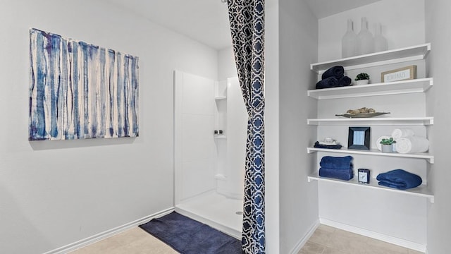 bathroom featuring tile patterned flooring and walk in shower