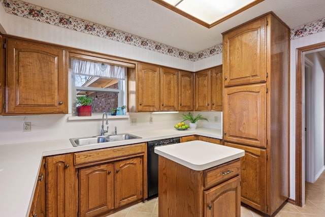 kitchen featuring sink, light tile patterned floors, dishwasher, a textured ceiling, and a kitchen island