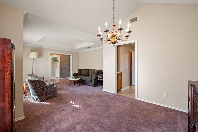 carpeted living room with a raised ceiling, ornamental molding, vaulted ceiling, and a notable chandelier