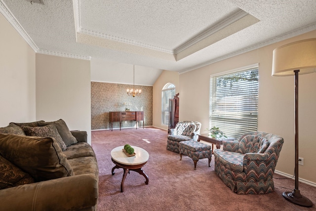 carpeted living room featuring crown molding, a textured ceiling, an inviting chandelier, and a tray ceiling