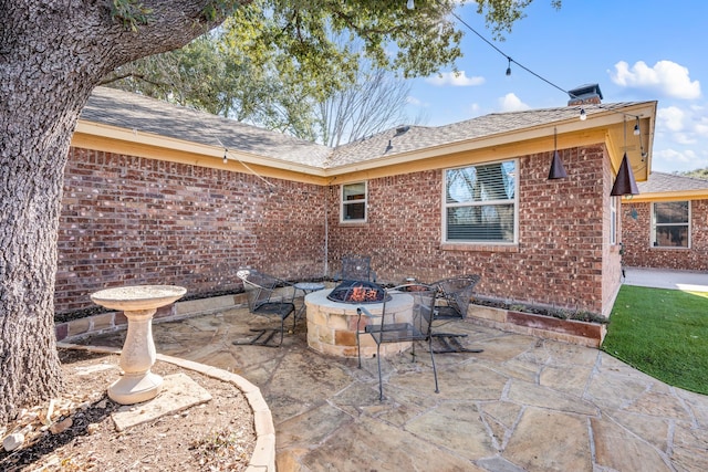 view of patio featuring an outdoor fire pit