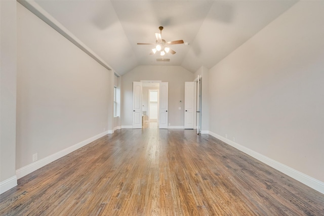 unfurnished room with dark wood-type flooring, ceiling fan, and lofted ceiling