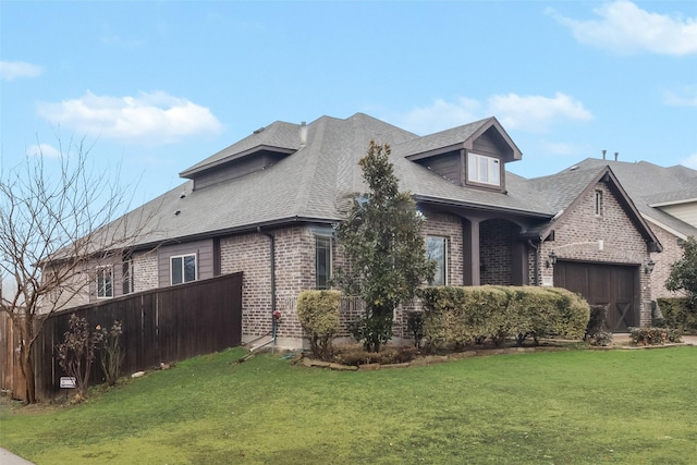 exterior space with a garage and a front yard