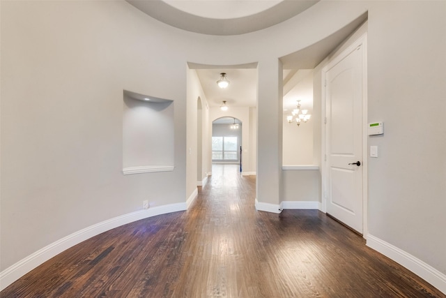 corridor with dark wood-type flooring