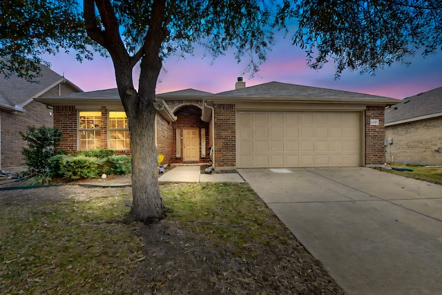 ranch-style house featuring a garage