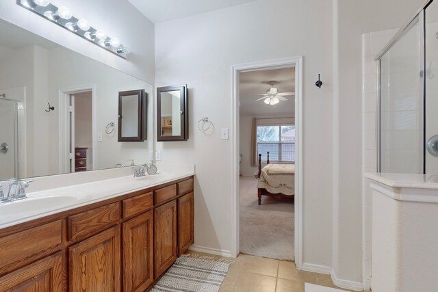 carpeted bedroom with ceiling fan and vaulted ceiling