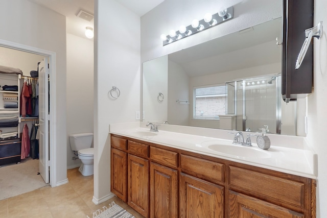 full bath featuring toilet, a shower stall, visible vents, and a sink