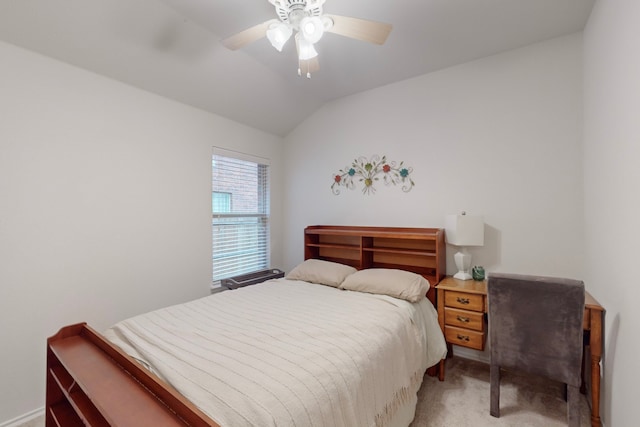 bedroom featuring vaulted ceiling, a ceiling fan, and light colored carpet