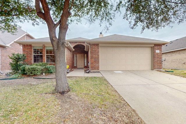 ranch-style house with a garage and a front lawn