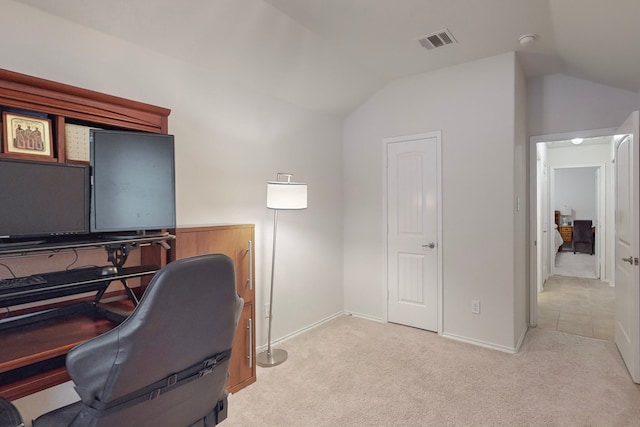 office area with vaulted ceiling, baseboards, visible vents, and light colored carpet