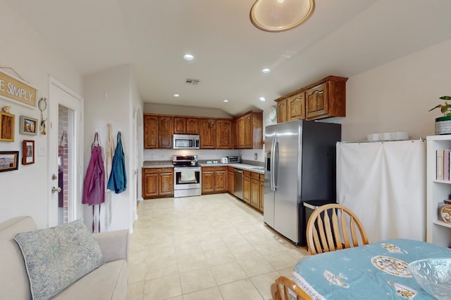 kitchen with visible vents, brown cabinetry, appliances with stainless steel finishes, light countertops, and recessed lighting