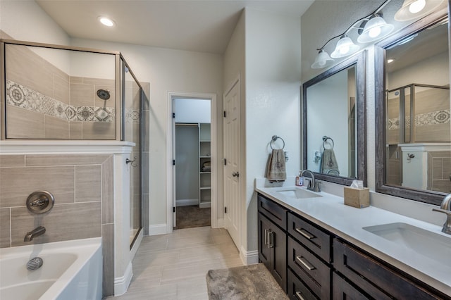 3032 James Ave, Fort Worth, TX 76110 - bathroom with a shower stall, double vanity, a bath, baseboards, and a walk in closet