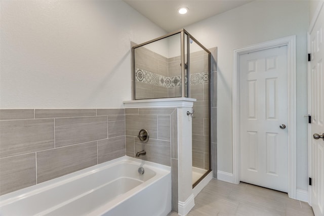 bathroom with shower with separate bathtub