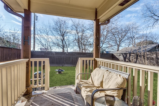 wooden terrace with a lawn