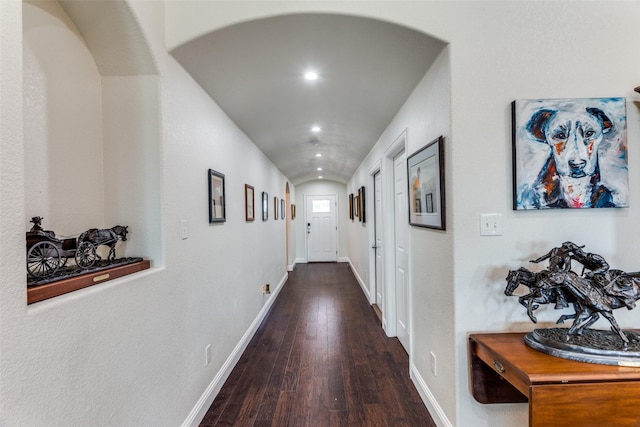 hallway with dark hardwood / wood-style floors