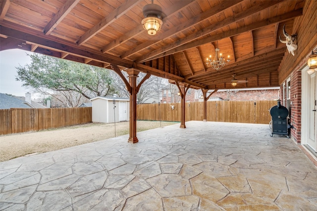 view of patio / terrace featuring a storage shed