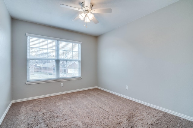 empty room with ceiling fan and carpet flooring