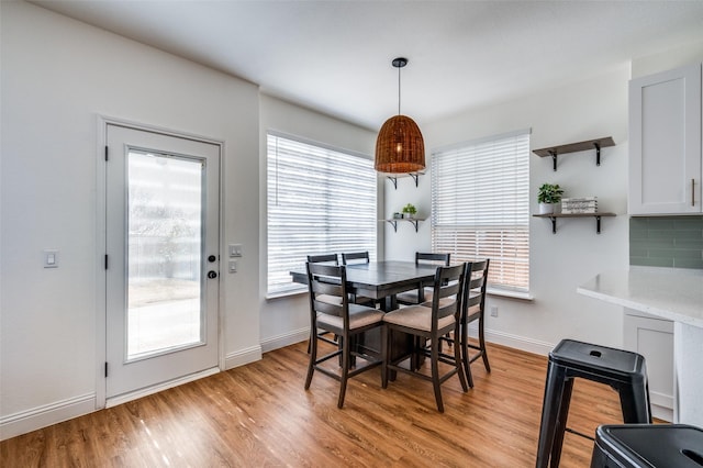 dining room with light hardwood / wood-style flooring