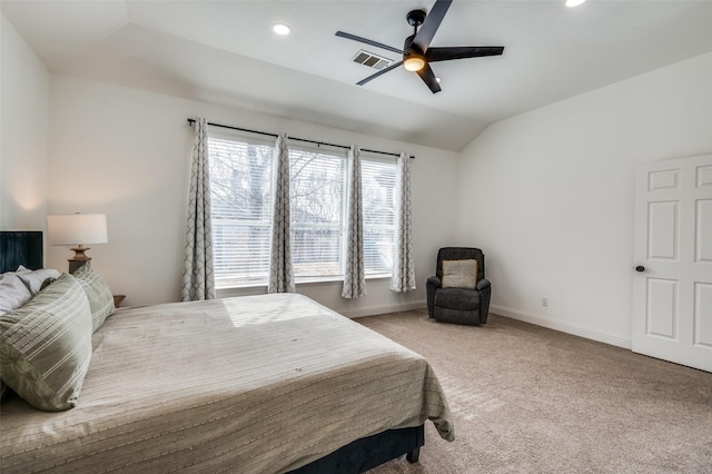 carpeted bedroom with vaulted ceiling and ceiling fan