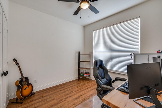 office space featuring wood-type flooring and ceiling fan